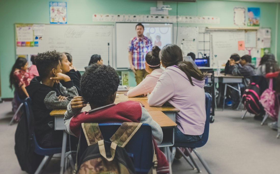 Learners following a structured course in a classroom